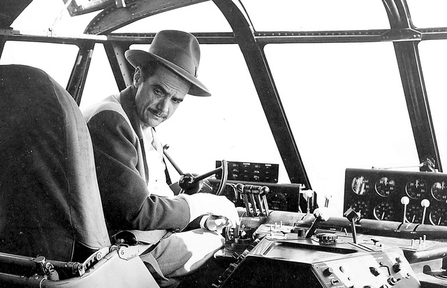 Businessman and aviator Howard Hughes sits in the cockpit of the H-4 Hercules (Spruce Goose) sea plane in the waters off Long Beach, California on Nov. 2, 1947, prior to taking the massive 8-engin ...