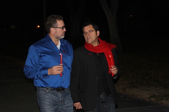 AFAN executive director Antioco Carrillo and his partner Theo Small march to a World AIDS Day ceremony at UNLV's AIDS Memorial Garden on Dec. 1. (Wesley Juhl/Las Vegas Review-Journal)