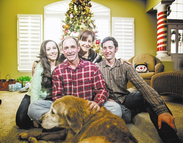 Mike Martin with daughter Kylee, left, wife Kris,  son Casey and family dog Tyson in their home on northwest Las Vegas on Tuesday, Dec. 24, 2013. The longtime director of the Las Vegas Baseball Ac ...