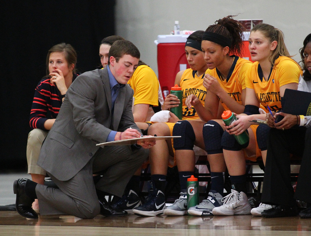 Marquette assistant coach Tyler Summitt, son of NCAA women's basketball coaching legend Pat Summitt, talks with players as the Golden Eagles take on Tennessee Tech at the South Point Arena in Las  ...