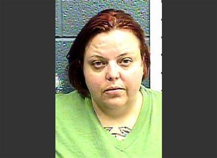 This file image provided Jan. 25, 2013 by the Las Cruces Police Department shows Cindy Patriarchias, following her arrest for child abuse. Patriarchias pleaded guilty Monday, Dec. 23, 2013, to two ...