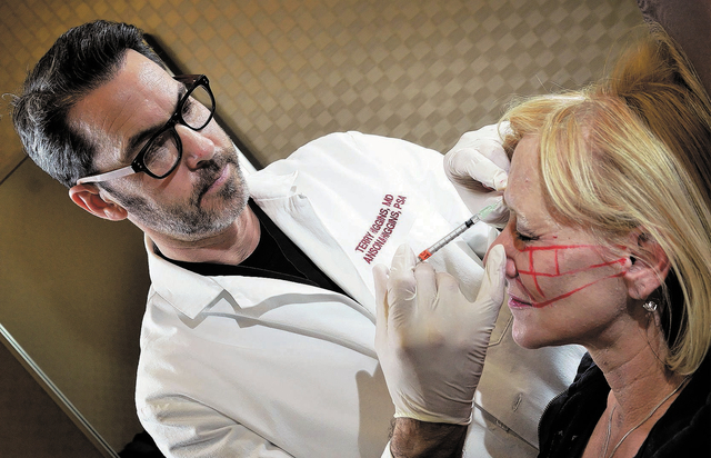 Dr. Terry Higgins injects Debbie Hale with Botox at Anson and Higgins Plastic Surgery Associates at 8530 W. Sunset Road in Las Vegas on Dec. 20. (Bill Hughes/Las Vegas Review-Journal)