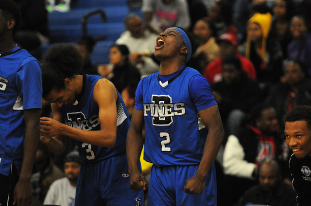 Desert Pines Tim Hough (2) and Kevin Butler (3) react to a play from the sideline in their away game against Canyon Springs, Thursday, Dec. 5, 2013. Canyon Springs won the game 66-61 against the J ...