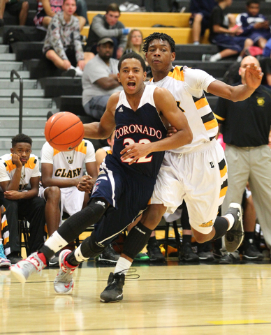 Coronado's Eddie Austin (22) looks to go for a shot as he gets past Clark's Darius Jackson (44) during a basketball game at Clark High School in Las Vegas on Monday, Dec. 2, 2013. (Chase Stevens/L ...