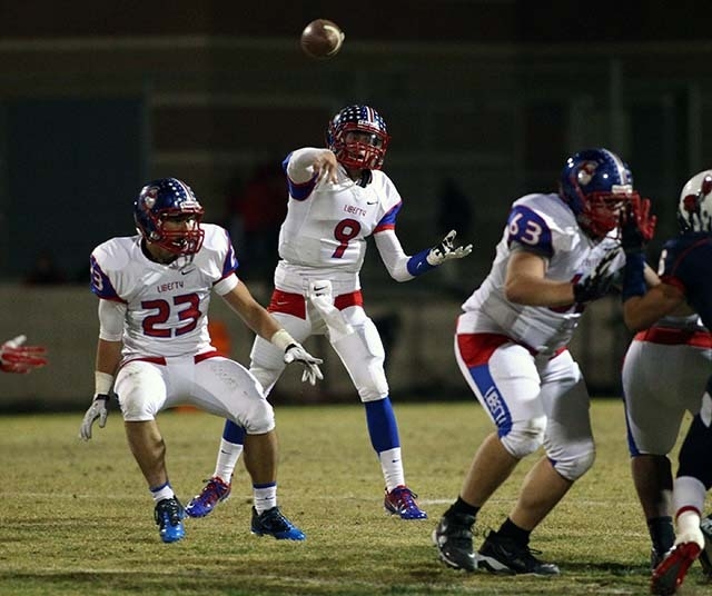 Liberty's Tyler Newman (9) makes a pass while playing against Coronado during a football game at Coronado High School in Henderson on Friday, Oct. 4, 2013. (Chase Stevens/Las Vegas Review-Journal)