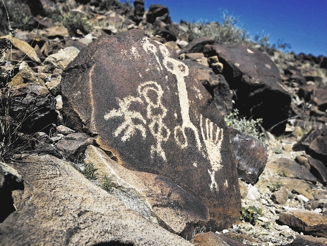 Petroglyphs as seen Friday, March 1, 2013 at Petroglyph Canyon in Sloan Canyon National Conservation Area. There are 300 rock panels made by native cultures during the Archaic period (8,000-1,000  ...