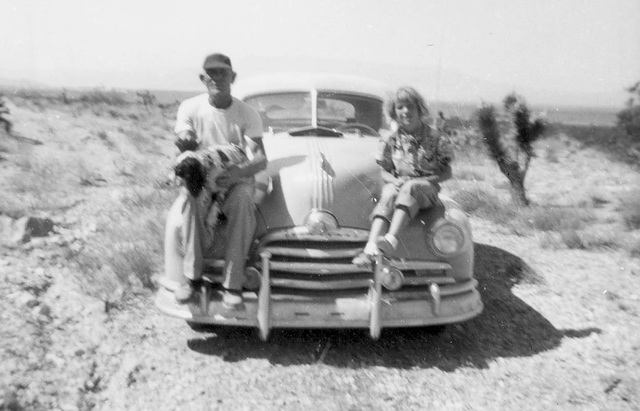 In an undated photo from the mid 1950s, Terri Robertson and her father, George Potter, sit on the front of his 1948 Pontiac during an outing in Hidden Valley, near what is now Sloan Canyon Nationa ...