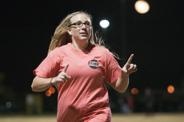 Claire Roberts, member of kickball team Kick'er & Lick'er, signals to her teammates on the sideline during their game against Cream Team at Desert Breeze Park in Las Vegas, Wednesday, Nov. 20, 201 ...