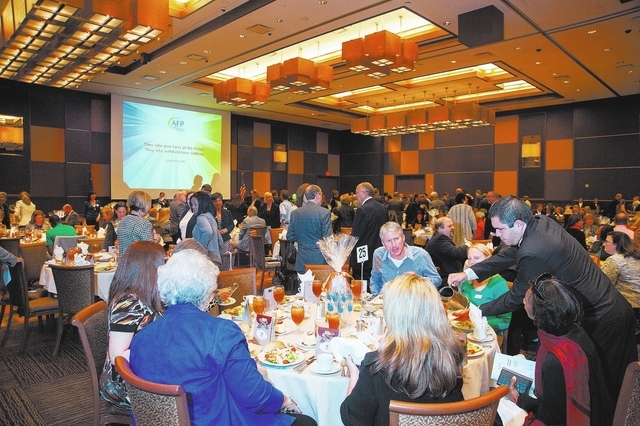 Guests mingle and enjoy lunch during the Association of Fundraising Professionals 22nd Annual National Philanthropy Day Awards Luncheon at the Golden Nugget hotel-casino in Las Vegas on Nov. 19, 2 ...