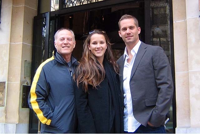 Paul Walker, right, with Aubrianna Atwell of Las Vegas and "Eight Below" director Frank Marshall in front of the Plaza Athenee in Paris during the European press tour. (Courtesy photo)