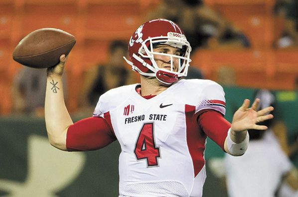 Fresno State quarterback Derek Carr has completed 70.1 percent of his passes for an average of 405.5 yards per game with 48 touchdowns and seven interceptions this season. (AP Photo/Eugene Tanner)