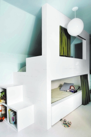 This photo provided by Brian Patrick Flynn shows architectural bunk beds by Interior designer Flynn who says that bunk rooms are becoming more and more popular with homeowners who have awkward bon ...