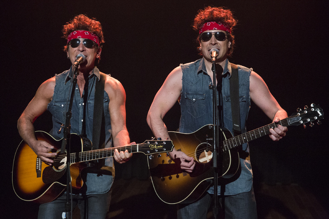 This image released by NBC shows Bruce Springsteen, left, and Jimmy Fallon performing during "Late Night with Jimmy Fallon," on Tuesday, Jan. 14, 2014 in New York. (AP Photo/NBC, Lloyd B ...