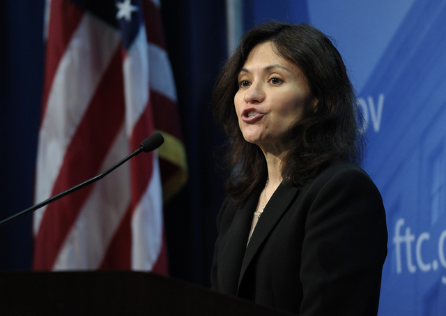 Federal Trade Commission (FTC) Chair Edith Ramirez speaks at the FTC in Washington, Wednesday, Jan. 15, 2014, where she announced Apple will refund $32.5 million to consumers to settle a federal c ...