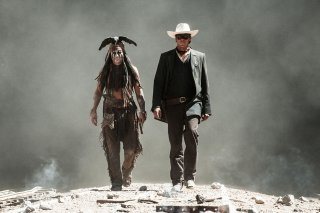 This undated publicity photo released by Disney and Jerry Bruckheimer, Inc. shows Johnny Depp, left, as Tonto, and Armie Hammer, as The Lone Ranger, in a scene from the film, "The Lone Ranger ...
