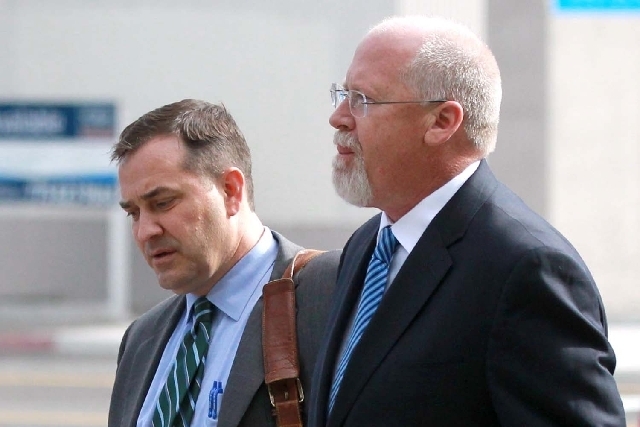 Harvey Whittemore, right, and attorney John Arrascada walk from the federal courthouse in Reno on June 7. A Nevada State Bar panel has 30 days to recommend whether Whittemore should keep his law l ...
