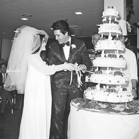 Priscilla Beaulieu Presley, left, and Elvis Presley cut the six-tiered cake shortly after their wedding at the Aladdin Hotel-Casino in Las Vegas on May 1, 1967. (Don Zirkle/Las Vegas Review-Journal)