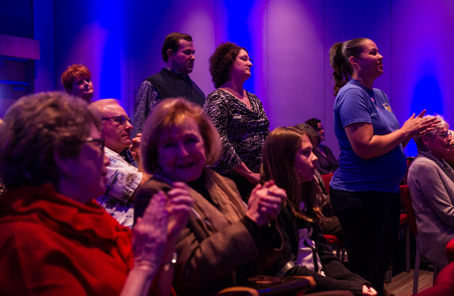 Attendees clap during a town hall panel, titled "Madam President," held by Emily's List, at the Student Union at the University of Nevada, Las Vegas on Thursday, Jan. 30, 2014. The polit ...