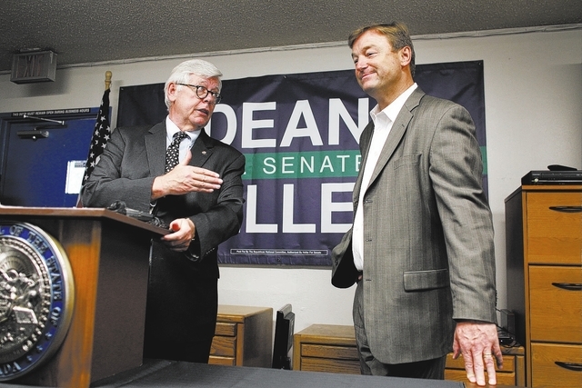 National Rifle Association President David Keene, left, announces the NRA's endorsement of Sen. Dean Heller, R-Nev., right, at The Gun Store in Las Vegas Friday, Oct. 12, 2012. (John Locher/Las Ve ...