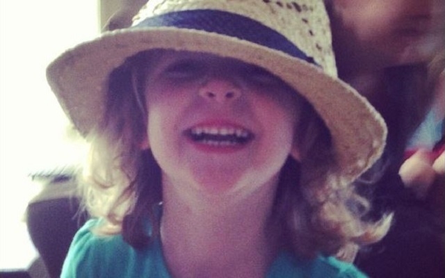 Kate Mouland, who has autism, made friends with a businessman on a recent flight. Her mother wrote an open letter thanking him, which has since gone viral. (Go Team Kate/Facebook)