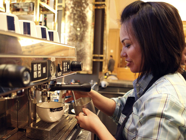 Wendy Larson, a barista at Press at the Four Seasons, prepares a latte. She’s been creating latte art for about two years using a Lavazza Blue machine. If you see a person creating latte art, sh ...