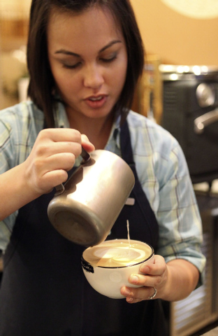 Wendy Larson, a barista at the Four Seasons, prepares a latte that she will adorn with art made from the milk added to the finished product. (Jerry Henkel/Las Vegas Review-Journal)