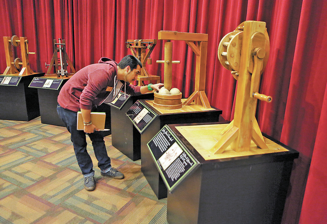 Tito Garcia looks at an interactive display shown at "Leonardo Da Vinci: Machines in Motion" exhibit at Springs Preserve Thursday, Jan. 23, 2014, in Las Vegas. The exhibit, which is loca ...
