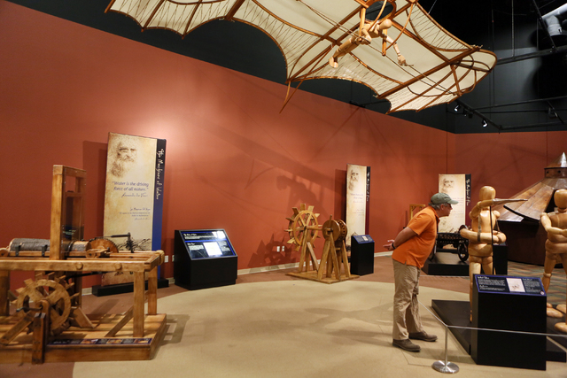 Chris Sakmar looks at an interactive display shown at "Leonardo Da Vinci: Machines in Motion" exhibit at Springs Preserve Thursday, Jan. 23, 2014, in Las Vegas. The exhibit, which is loc ...