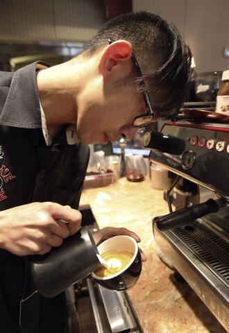 Barista Lawrence Chung creates art in cups of latte at Leone Cafe in Tivoli Village in Las Vegas, Thursday, Jan. 9, 2014. (Jerry Henkel/Las Vegas Review-Journal)