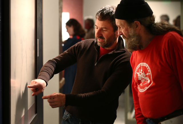 Anthony Edwards, left, and Joel Tracy look at a map during the grand opening event for the "Finding Fremont: Pathfinder of the West" exhibit at the Nevada State Museum, in Carson City, N ...