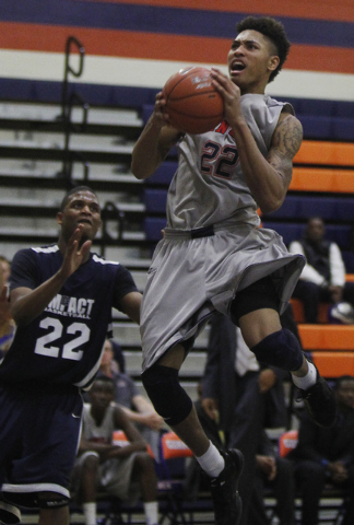 Findlay Prep's Kelly Oubre (22) goes to the hoops against Impact Academy's Dez Marshall (22) at Bishop Gorman in Las Vegas on Saturday, Jan. 11, 2014. (Jason Bean/Las Vegas Review-Journal)