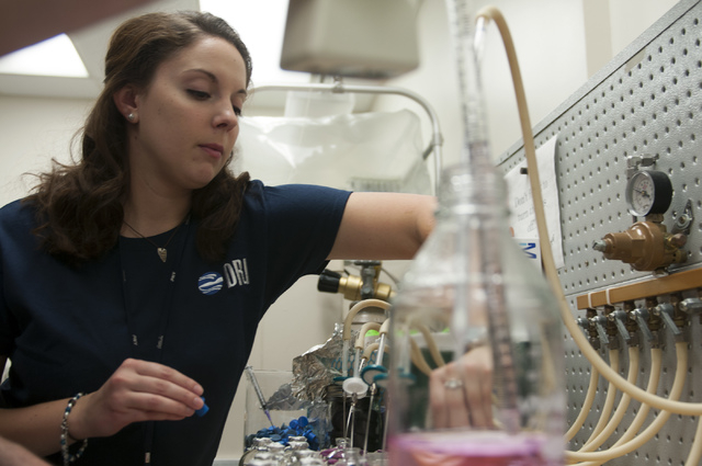 Katie Willever, graduate student at UNLV's microbiology department, prepares bottles for bacteria cultivation using anaerobic media at the Desert Research Institute in Las Vegas Friday, Jan. 3, 20 ...