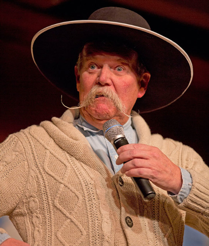 Cowboy poet Waddie Mitchell performs during the "Home Means Nevada" show during the 30th National Cowboy Poetry Gathering on Monday in Elko. (AP Photo/Elko Daily Free Press, Ross Andreson)