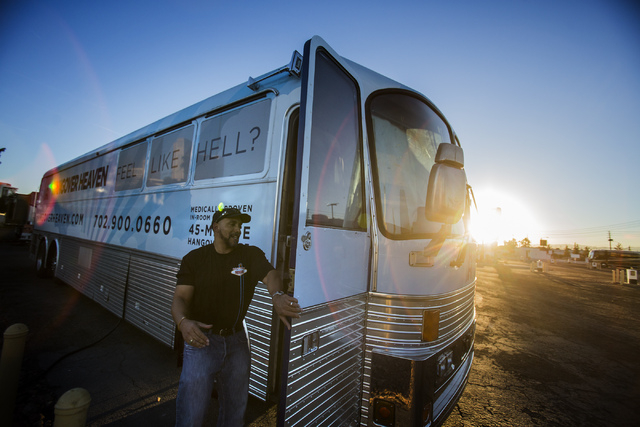 Darien Cohen PhD, director of operation for Hangover Heaven, stands outside the  mobile clinic bus parked at the Las Vegas KOA Circus Circus, 500 Circus Circus Drive, on Thursday, Jan. 2, 2014. Th ...