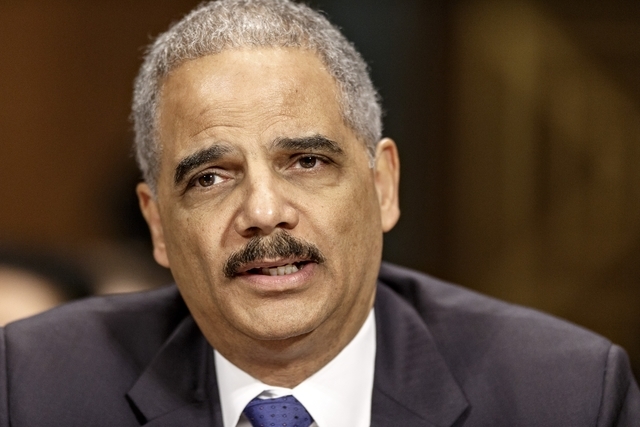 Attorney General Eric Holder testifies on Capitol Hill in Washington. In an assertion of same-sex marriage rights, Holder is applying a landmark Supreme Court ruling to the Justice Department, ann ...