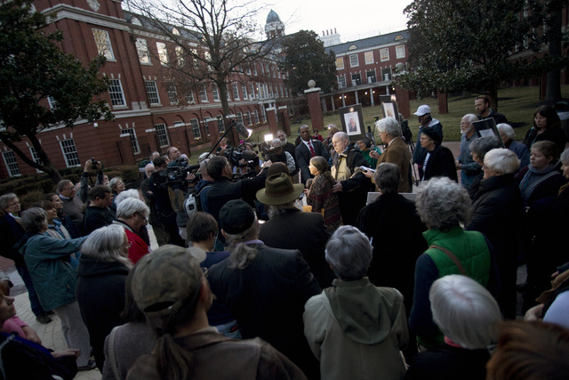 Supporters, reporters, and family gather around Michele Naar-Obed as she makes a statement concerning the sentencing of her husband Greg Boertje-Obed and two others for the role they played in a J ...