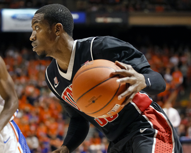 UNLV's Deville Smith moves the ball during the first half of an NCAA college basketball game against Boise State in Boise, Idaho, Saturday, Feb. 22, 2014. Boise State won 91-90 in overtime. (AP Ph ...