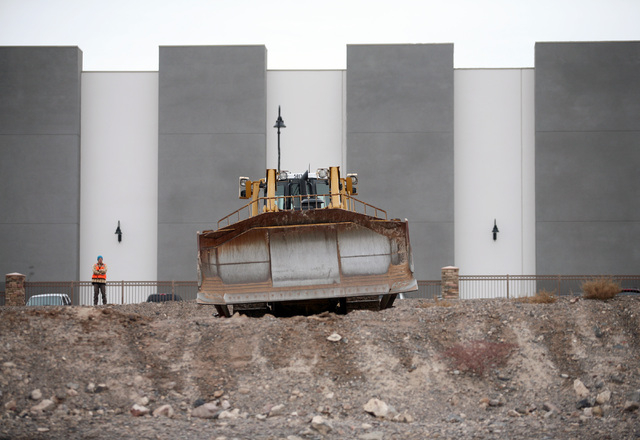 A crew works on a parcel of land north of RC Willey Home Furnishings located on Stephanie Street near the 215 Beltway Thursday, Feb. 6, 2014, in Henderson. The Canyon-Agassi Charter School Facilit ...