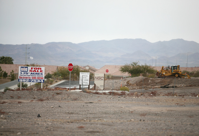 A crew works on a parcel of land north of RC Willey Home Furnishings located on Stephanie Street near the 215 Beltway Thursday, Feb. 6, 2014, in Henderson. The Canyon-Agassi Charter School Facilit ...