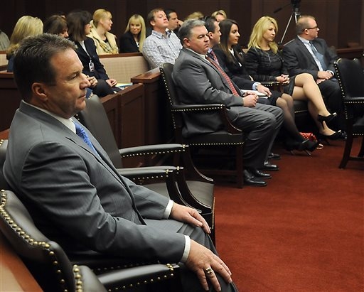 Eddie Lorton, a candidate for Reno mayor, front left, sits in the Nevada Supreme Court Tuesday Jan. 21, 2014 along with Dwight Dortch, in gray suit and red tie, and Jessica Sferrazza, second right ...