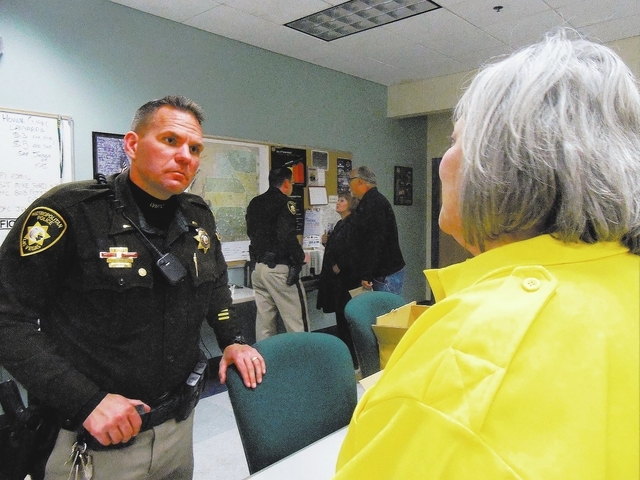 Lt. John Pelletier of the Metropolitan Police Department speaks with a resident Feb. 4 during a 1st Tuesday event at the Northwest Area Command, 9850 W. Cheyenne Ave. (Jan Hogan/View)