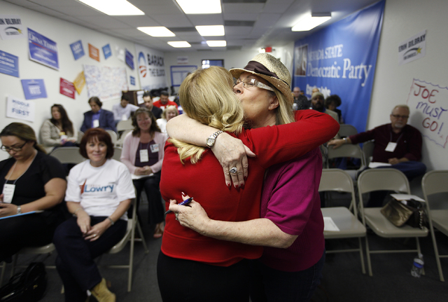 Audrey Dempsey, right, hugs democratic congressional candidate Erin Bilbray at a precinct meeting in Las Vegas Saturday, Feb. 22, 2014. Bilbray is running against U.S. Rep. Joe Heck, R-Nev.(John L ...