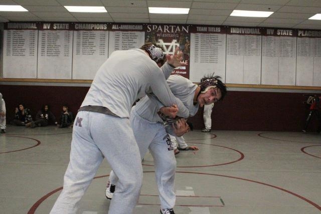 Angel Laurente, right, locks up Michael Barnson’s arm during a recent practice, in pre ...