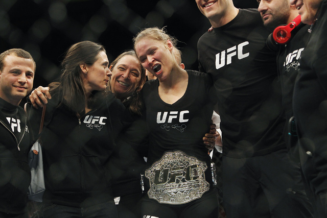 Ronda Rousey celebrates with her team after defeating Sara McMann during UFC 170 at the Mandalay Bay Events Center in Las Vegas on Saturday night, Feb. 22, 2014. Rousey retained her Women's Bantam ...