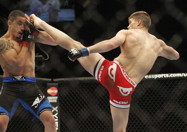Stephen Thompson, right, kicks Robert Whittaker during UFC 170 at the Mandalay Bay Events Center in Las Vegas on Saturday night, Feb. 22, 2014. (Jason Bean/Las Vegas Review-Journal)