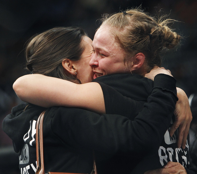 Ronda Rousey celebrates after defeating Sara McMann during UFC 170 at the Mandalay Bay Events Center in Las Vegas on Saturday night, Feb. 22, 2014. (Jason Bean/Las Vegas Review-Journal)