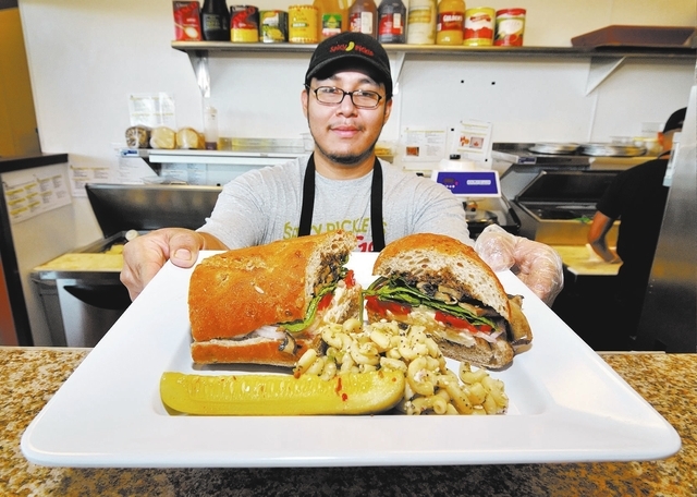 RJ FILE***
Alfonso Vazquez serves up a Garden State sandwich at the Spicy Pickle restaurant on Thursday, Sept. 29, 2011. The restaurant specializes in sandwiches but also offers flatbread pizzas,  ...