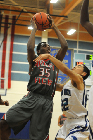 Arbor View’s Terrell Butler (35) takes a shot at the basket over Sierra Vista’s ...