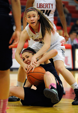 Liberty’s Kealy Brown, top, and Coronado’s Skylar Feldman battle for a loose bal ...