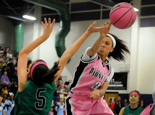 Canyon Springs’ Cherise Beynon (3) blocks a shot by Green Valley’s Milena Palor ...